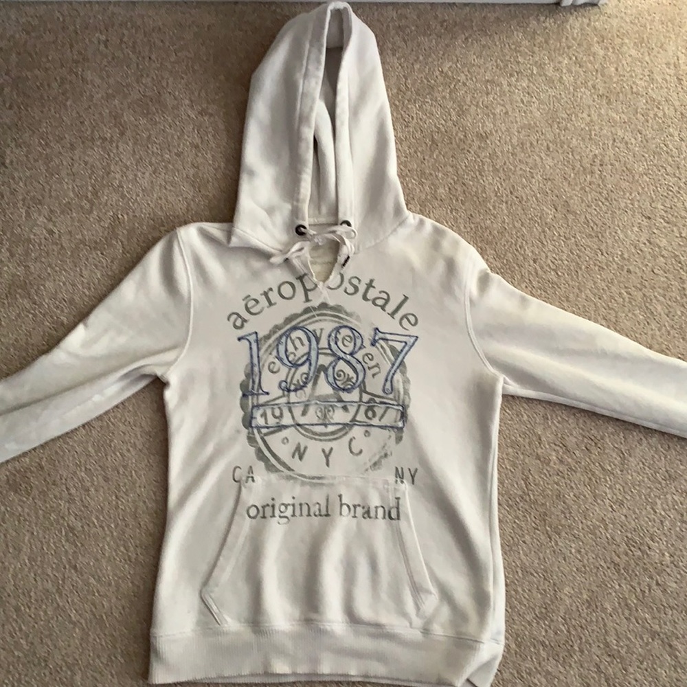 Gently used women’s white sweatshirt, size small.
